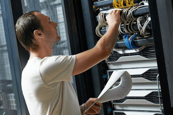 man examining wiring